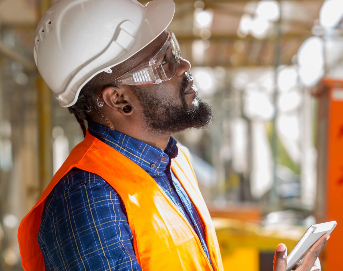 man wearing osha mandated ppe on the job