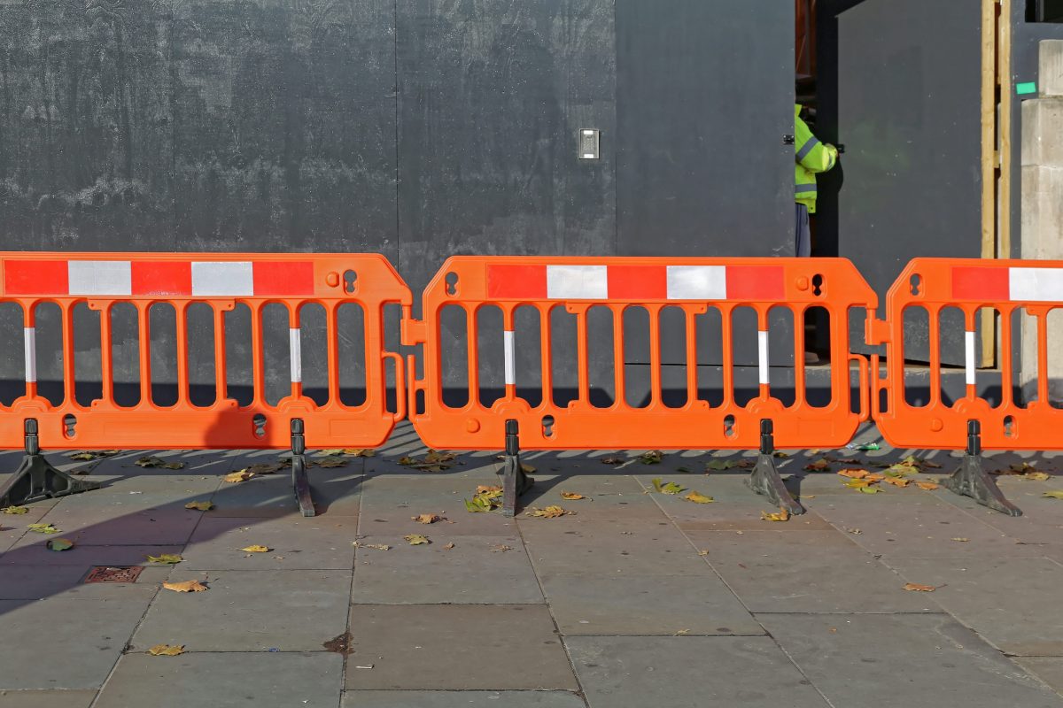 securing a construction site with barricades and locked doors